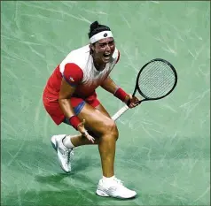  ?? JULIA NIKHINSON/ASSOCIATED PRESS ?? Ons Jabeur of Tunisia reacts after defeating Caroline Garcia of France in the semifinals of the U.S. Open on Thursday in New York. Jabeur is the first African woman to reach the final in the open era.