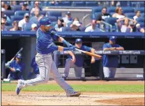  ?? SETH WENIG/THE ASSOCIATED PRESS ?? Toronto’s Jose Bautista hits a solo home run in the fourth inning of Sunday’s game at Yankee Stadium.