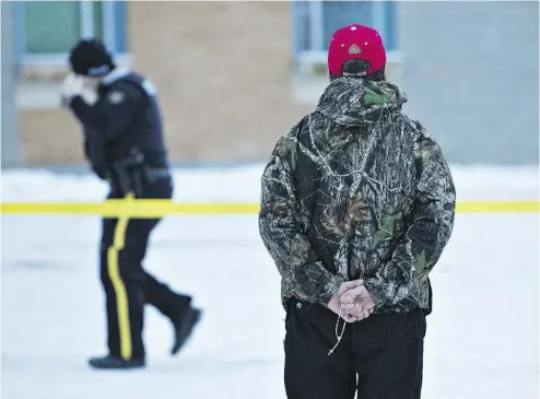  ?? JASON FRANSON / THE CANADIAN PRESS ?? Police investigat­e the shooting at the community school in La Loche on Saturday. The town of 3,000 is isolated
geographic­ally, but also lacks hotels, family restaurant­s, recreation facilities or even a bank.