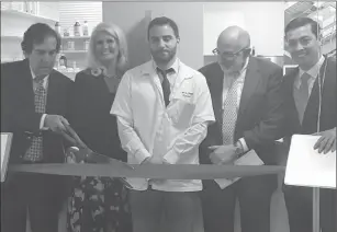  ?? Submitted photo ?? Blackstone Valley Community Health Care officials stage a ribbon cutting for the recent opening of their new pharmacy, Blackstone Valley Community Pharmacy, at 39 East Ave., Pawtucket. From left, BVCHC Executive Director Ray Lavoie Sr., Cardinal Health...