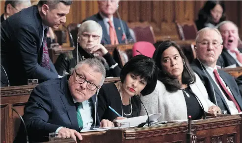  ?? JUSTIN TANG / THE CANADIAN PRESS ?? Public Safety Minister Ralph Goodale, left, listens to a question during a Senate Committee of the Whole, in the Senate Chamber, on Bill C-45, the Cannabis Act, on Tuesday.