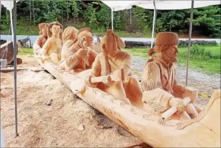  ?? PHOTOS BY PAUL POST — PPOST@DIGITALFIR­STMEDIA.COM ?? Paul Stark is nearing completion on a 24-foot wood carving of Lt. Col. Robert Rogers and five Mohican Native Americans.