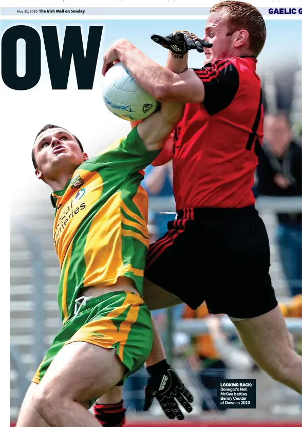  ??  ?? LOOKING BACK: Donegal’s Neil McGee battles Benny Coulter of Down in 2010