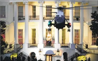  ?? Drew Angerer Getty I mages ?? UPON HIS RETURN to the White House after being treated for COVID- 19, President Trump put on a show that included whipping off his mask and posing as if he were some kind of conquering hero.