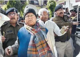  ?? PTI ?? Bihar’s former chief minister Lalu Yadav escorted by police officials after appearing at the special CBI court, in Ranchi on Wednesday