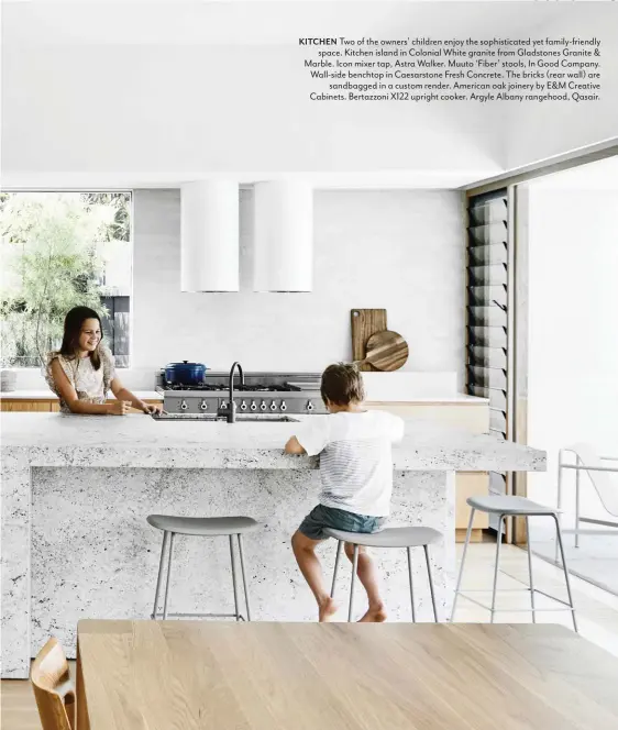  ??  ?? KITCHEN Two of the owners’ children enjoy the sophistica­ted yet family-friendly space. Kitchen island in Colonial White granite from Gladstones Granite & Marble. Icon mixer tap, Astra Walker. Muuto ‘Fiber’ stools, In Good Company. Wall-side benchtop in Caesarston­e Fresh Concrete. The bricks (rear wall) are sandbagged in a custom render. American oak joinery by E&M Creative Cabinets. Bertazzoni X122 upright cooker. Argyle Albany rangehood, Qasair.