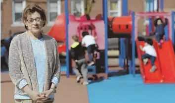  ?? STAFF PHOTO BY CHRISTOPHE­R EVANS ?? HELPING HAND NEEDED: Principal Olga Frechon is hoping the community will raise $50,000 to replace the 30-year-old playground at East Boston Early Education Center.