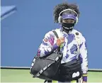  ?? DANIELLE PARHIZKARA­N/ USA TODAY ?? Naomi Osaka wore face masks bearing names of Black victims of police brutality.