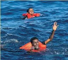  ??  ?? Refugees in the sea off Lampedusa last month, among 70,000 rescued so far this year