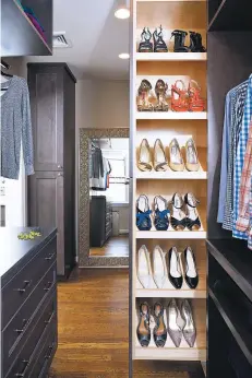  ?? PHOTOS BY STACY ZARIN GOLDBERG/CASE DESIGN VIA AP ?? As you plan out a walk-in closet, consider the size of the items you’ll be hanging and storing. This closet designed by Elena Eskandari, an interior designer specialist at Case Design, has two levels of hanging space, which offers room for a large collection of shirts and blouses, top. It also has a retractabl­e shoe storage area that keeps shoes organized and easily visible, bottom.