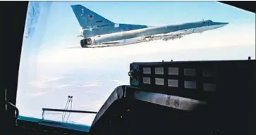  ?? Russian Defense Ministry Press Service ?? A RUSSIAN bomber trains over Belarus in an image from video. U.S. officials say Russia has assembled 70% of the firepower it likely intends to have in place by mid-month to give it the option of a full Ukraine invasion.