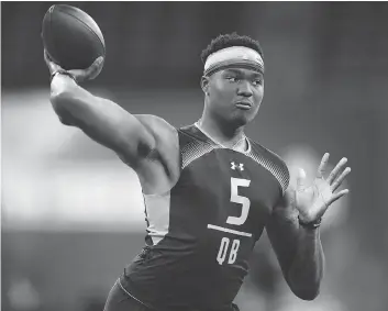  ?? JOE ROBBINS / GETTY IMAGES ?? Quarterbac­k Dwayne Haskins of Ohio State works out earlier this month at the NFL Combine. He and Kyler Murray are highly touted in the draft, but who will take them is far from certain.