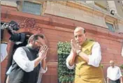  ?? ARVIND YADAV/HT ?? Union ministers Rajnath Singh and Mukhtar Abbas Naqavi greet each other at Parliament in New Delhi on Friday.