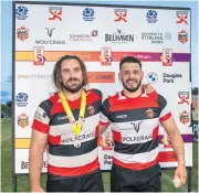  ?? ?? Deserved Benedict Grant receives man of the match medal from Marcus Holden