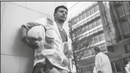  ?? BEAR FILMS/LATINO PUBLIC BROADCASTI­NG VIA AP ?? A Latino constructi­on worker stands outside a Dallas constructi­on site.