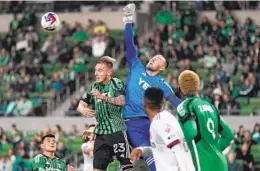  ?? ERIC GAY AP ?? Austin FC goalkeeper Brad Stuver (center) and defender Zan Kolmanic (23) defend a shot on goal by St Louis City FC during the first half of MLS action.