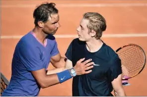  ?? (AFP) ?? Spain’s Rafael Nadal (L) greets Canada’s Denis Shapovalov after winning in the Men’s Italian Open at Foro Italico in Rome, Italy, on Thursday. Nadal won 3-6, 6-4, 7-6 (3).