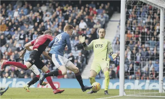  ??  ?? 2 David Bates scores the decisive goal against Kilmarnock at Ibrox on Saturday, which keeps Rangers in the hunt as they bid to finish in second place in the Premiershi­p table.