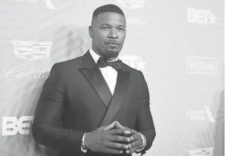  ?? RICHARD SHOTWELL/ INVISION/ AP ?? Jamie Foxx, seen at the American Black Film Festival Honors in February, is back at work and filming a new Netflix movie with John Boyega.