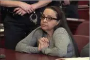  ?? WYNY-TV/POOL PHOTO VIA AP ?? In this image from video, Yoselyn Ortega, a trusted nanny to a well-to-do family, listens to court proceeding­s during the first day of her trial in New York Thursday, March 1, 2018. In October 2012, Ortega took two young children in her care into a bathroom at their Manhattan apartment, slaughtere­d them with a knife and then slit her own throat.