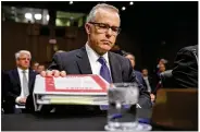  ?? ALEX WONG / GETTY ?? Acting FBI Director Andrew McCabe and the other heads of the U.S. intelligen­ce agencies prepare to testify before the Senate Intelligen­ce Committee.