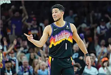  ?? MATT YORK / AP ?? Suns guard Devin Booker reacts to a play against the Mavericks during the second half of Game 1 in the Western Conference playoff semifinals Monday in Phoenix.