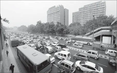  ?? Photograph­s by Harish Tyagi European Pressphoto Agency ?? TRAFFIC jams up in New Delhi. The car-crazed capital’s air pollution is, by most measures, the worst of any major city in the world.