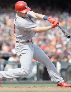  ?? (Photo by Ben Margot, AP) ?? St. Louis Cardinals’ Harrison Bader connects for an RBI-double off San Francisco Giants’ Kyle Crick in the seventh inning of Sunday’s game.