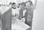  ?? Marco Ugarte / Associated Press ?? Priests pay their respects last month to Rev. Jose Alfredo Suarez de la Cruz, one of 15 clergymen killed in Mexico in the past four years.