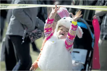  ?? ASHLEY FRASER/POSTMEDIA NETWORK ?? Two-and-a-half year old Cloe Rose Horrigan was all smiles at the Ottawa Egg Drop that took place in the fields at the Canada Aviation and Space Museum on Saturday.