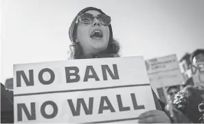  ?? DREW ANGERER/GETTY IMAGES ?? Government attempts to restrict travel brought out protesters in January in New York.