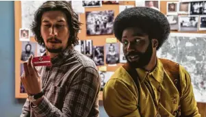  ?? Focus Features ?? Adam Driver, left, stars as the fictional Flip Zimmerman and John David Washington as Ron Stallworth in Spike Lee’s “BlacKkKlan­sman,” opening Friday.