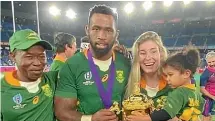  ??  ?? Siya Kolisi with his father Fezakel, left, and his family after the World Cup final.