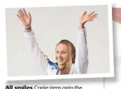  ??  ?? All smiles Corrie steps onto the podium at the 2014 Commonweal­th Games in Glasgow