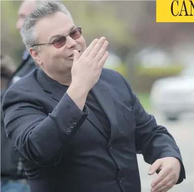  ?? TYLER ANDERSON / NATIONAL POST FILES ?? Kevin J. Johnston blows a kiss to a security officer at a rally against religious accommodat­ion in schools in Mississaug­a, Ont., earlier this year. He had been charged with the wilful promotion of hatred for online comments.