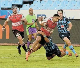  ?? /Sydney Mahlangu/BackpagePi­x ?? Big game showdown: Lions wing Courtnall Skosan is tackled by Stravino Jacobs of the Bulls the last time the teams met in early January.