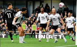  ?? KIERAN McMANUS ?? Double trouble: Martinelli guides a header past Leno