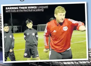  ??  ?? EARNING THEIR WINGS Longwell with kids at the Red Bull academy