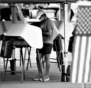  ?? AP Photo/Marcio Jose Sanchez ?? In this May 12 file photo, Arjan Walia votes during a special election in Santa Clarita, Calif.