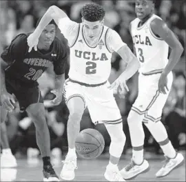  ?? Gina Ferazzi Los Angeles Times ?? FRESHMAN Lonzo Ball makes a steal during UCLA’s 42-point victory over UC Riverside, a game in which Ball took only three shots but had 13 assists.