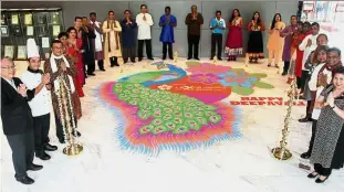  ??  ?? A team effort: Tan (third from left) and staff members posing with the kolam at the Lexis Hibiscus hotel lobby.