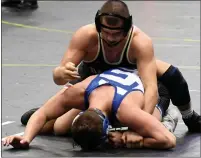  ?? DREW ELLIS — THE OAKLAND PRESS ?? Davison’s Alex Facundo (top) works for position against Detroit Catholic Central’s Cameron Adams during their 171-pound bout in the Division 1state finals.