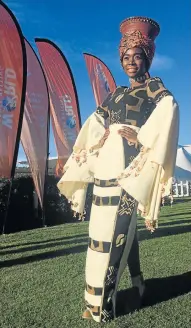  ?? Picture: GILLIAN McAINSH ?? FIRST PAST THE POST: Khanya Mjoli models the winning design by Habi Doucouré at Fairview Racecourse