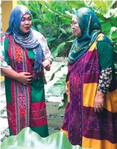  ??  ?? ALL DRESSED UP. Salika and her mother Saadera "Dida" Basmala Maguindana­o in their Maranao traditiona­l attire.