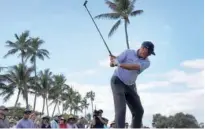  ?? Associated Press ?? Matt Kuchar hits from the 13th tee during the third round of the Sony Open in Honolulu on Saturday.
