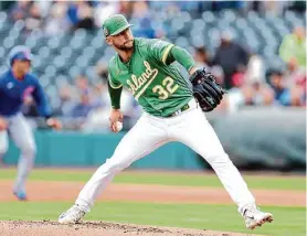  ?? Christian Petersen/Getty Images ?? A’s righthande­r James Kaprielian gave up a first-inning homer in Wednesday’s spring training start, but he settled down to work five innings against the Cubs.