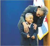  ?? CITY OF CHICAGO ?? Mayor Lori Lightfoot and Idris Lockett, age 4, who dressed as her for Halloween, met at Chicago’s City Hall for lunch in 2019.