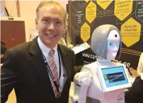  ?? Supplied photos ?? An exhibitor displays his robotic invention. —