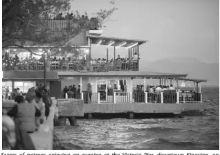  ?? GLADSTONE TAYLOR/MULTIMEDIA PHOTO EDITOR ?? Scores of patrons enjoying an evening at the Victoria Pier, downtown Kingston, on January 25. The renovated pier houses eateries and entertainm­ent venues and has become a regular spot for parties.