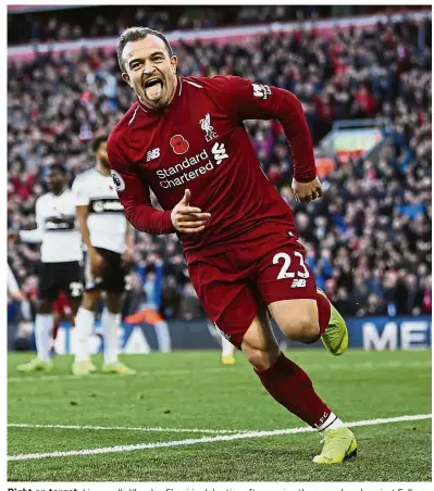  ?? —AP ?? Right on target: Liverpool’s Xherdan Shaqiri celebratin­g after scoring the second goal against Fulham during the English Premier League match at Anfield yesterday.